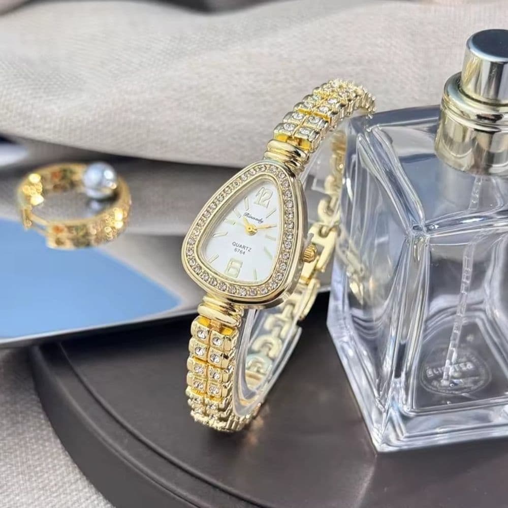 RELOJ OVAL DORADO CON BRILLOS