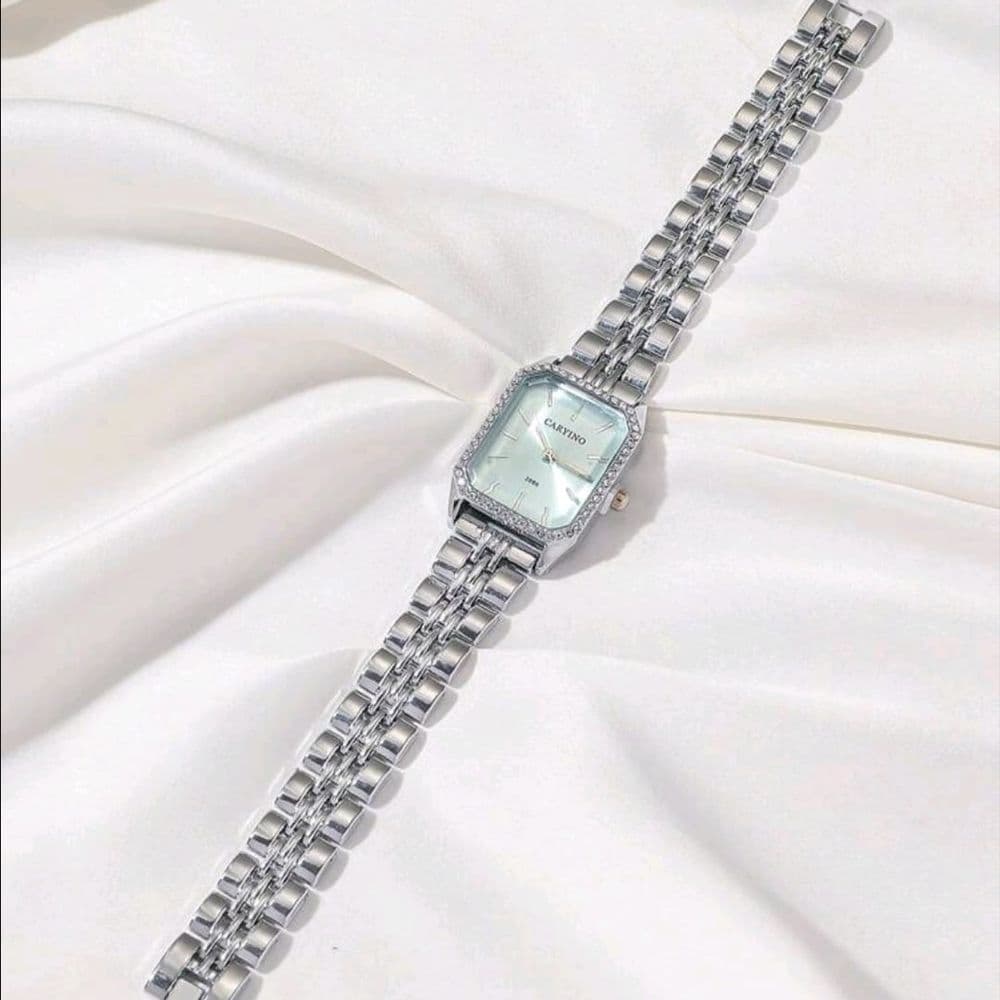 RELOJ CARYINO DE ACERO INOXIDABLE PLATEADO FONDO CELESTE